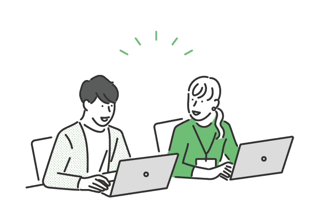 Two people collaborating on laptops, representing community connection and support